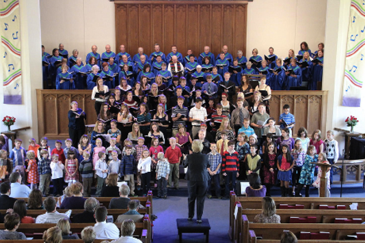 Diane Hires leading the combined DGFUMC choirs
